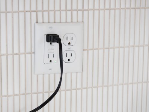 Power cord plugged into a GFCI outlet